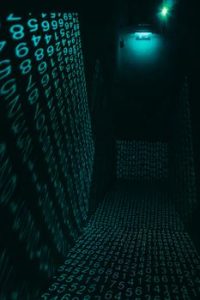 A dark hallway illuminated with neon digital number projections, creating a cyberpunk ambiance.